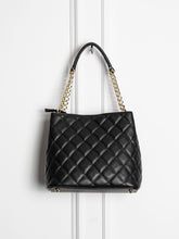 Small quilted leather bag with gold detail